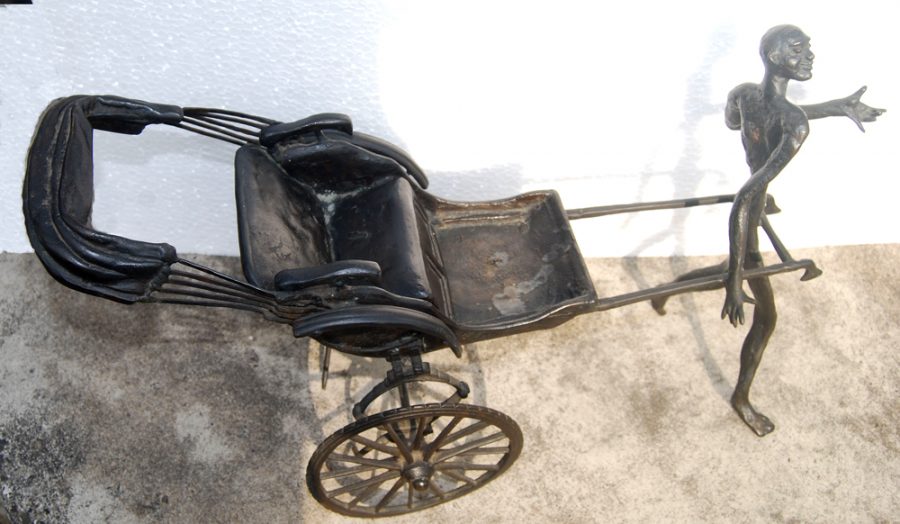 Song of the Road : A man happily pulling the yesteryears hand rickshaw; figurative, bronze, by Modern Master KS Radhakrishnan